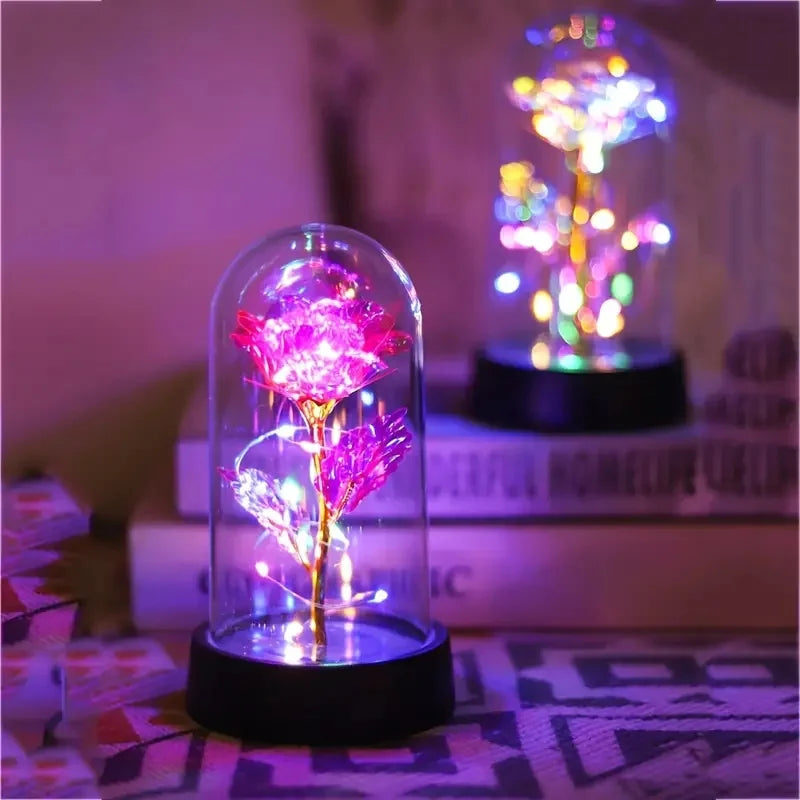 lampe led rose stabilisée dorée feuilles vertes moderne nuit multicolore base noire verre transparent