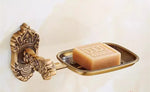 accessoires salle bain doré ornements sculptés finition brillante antique élégant porte serviettes savon toilette