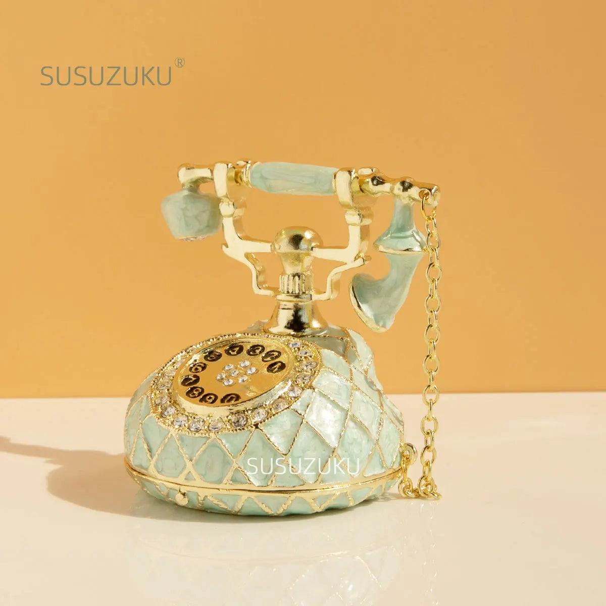 boîte bijoux téléphone vintage cuir géométrique violet vert clair élégant rétro chaîne dorée porte