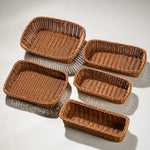 paniers osier marron clair tressage traditionnel poignées cuir noir rangement cuisine respectueux environnement