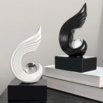 statuettes décoratives modernes or blanc noir spirale sphère transparente minimaliste sculptural