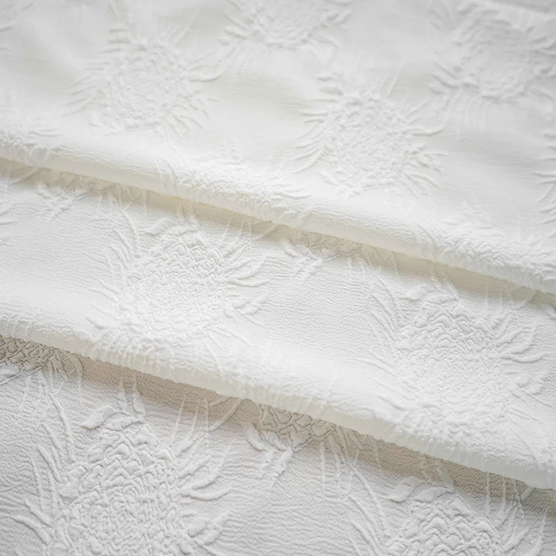 tissu polyester élastique fleurs blanches texture classique 150cm large 240g/m