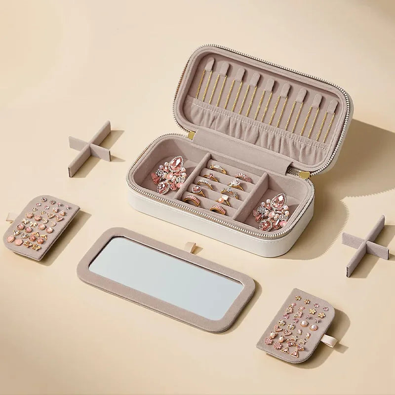 boîte bijoux portable beige simili cuir rayures modernes compartiments miroir fermeture glissière dorée bijoux