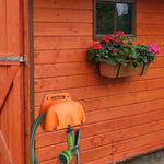organisateur tuyau d'arrosage enrouleur réglable mur noir orange moderne utilitaire maison adultes