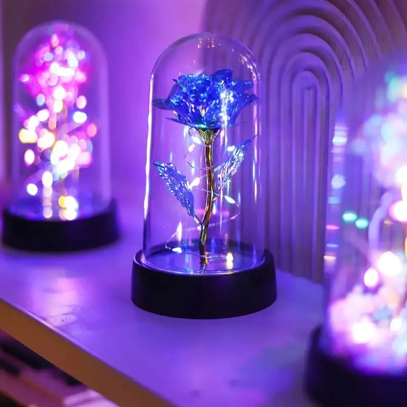 lampe led rose stabilisée dorée feuilles vertes moderne nuit multicolore base noire verre transparent