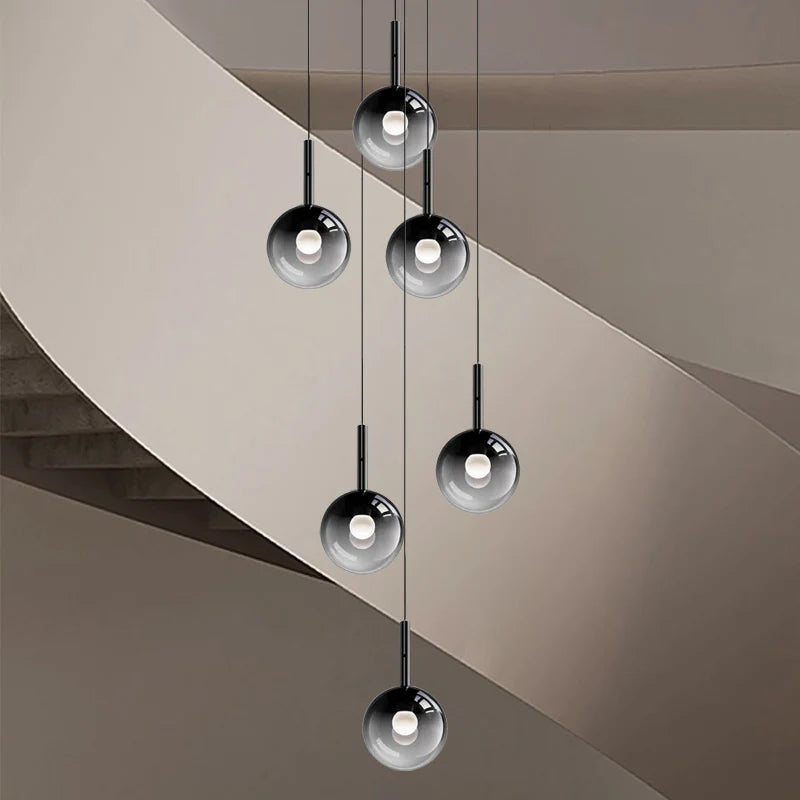 suspension lumineuse moderne minimaliste noir argenté plusieurs têtes éclairage intérieur salon escalier