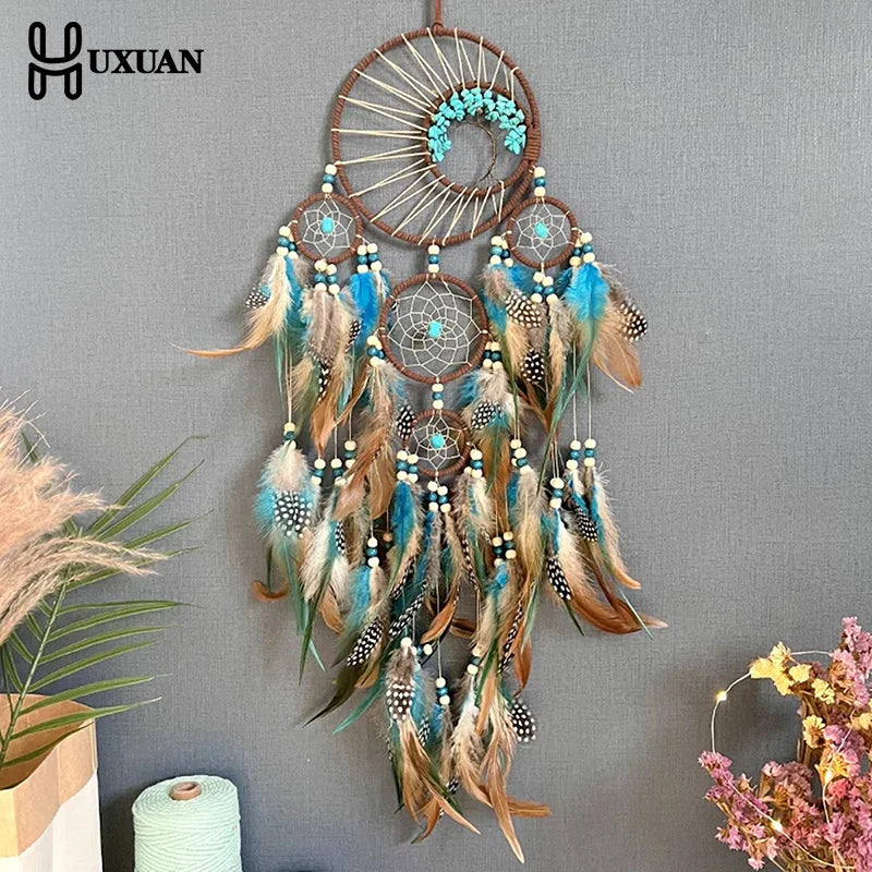 attrape rêves ethnique attrape rêves artisanal plumes bois marron bleu gris blancsuspendu fil