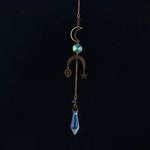bijou pendentif cristal or bleu violet vert formes géométriques motifs oculaires translucides boho chic