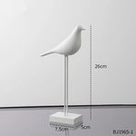 statues oiseaux noir blanc minimaliste sculpture deco intérieur base plate pieds minces
