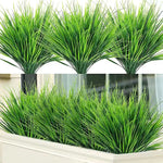 décoration extérieure herbes artificielles pots feuilles vertes longues fines nature morte salonextérieur