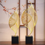sculpture décorative feuille stylisée or noir moderne minimaliste ajourée asiatique fixée socle bois