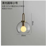 suspension lumineuse moderne gris fumé doré verre mat métal poli ampoule filament visible chambre