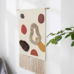 tapis suspendus géométrique franges moderne beige rose bleu vert noir gris