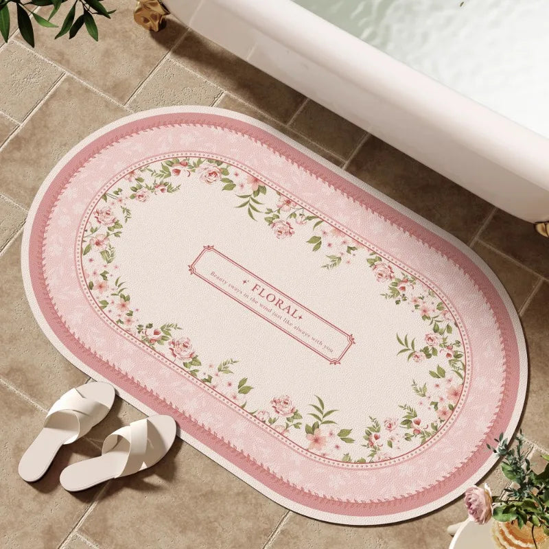 tapis bain rose clair fleurs vertes bordure ornée résistant décoloration moderne classique ovale 40x60cm