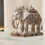statue élégante éléphant blanc doré artisanal support transparent traditionnel ornement diamants