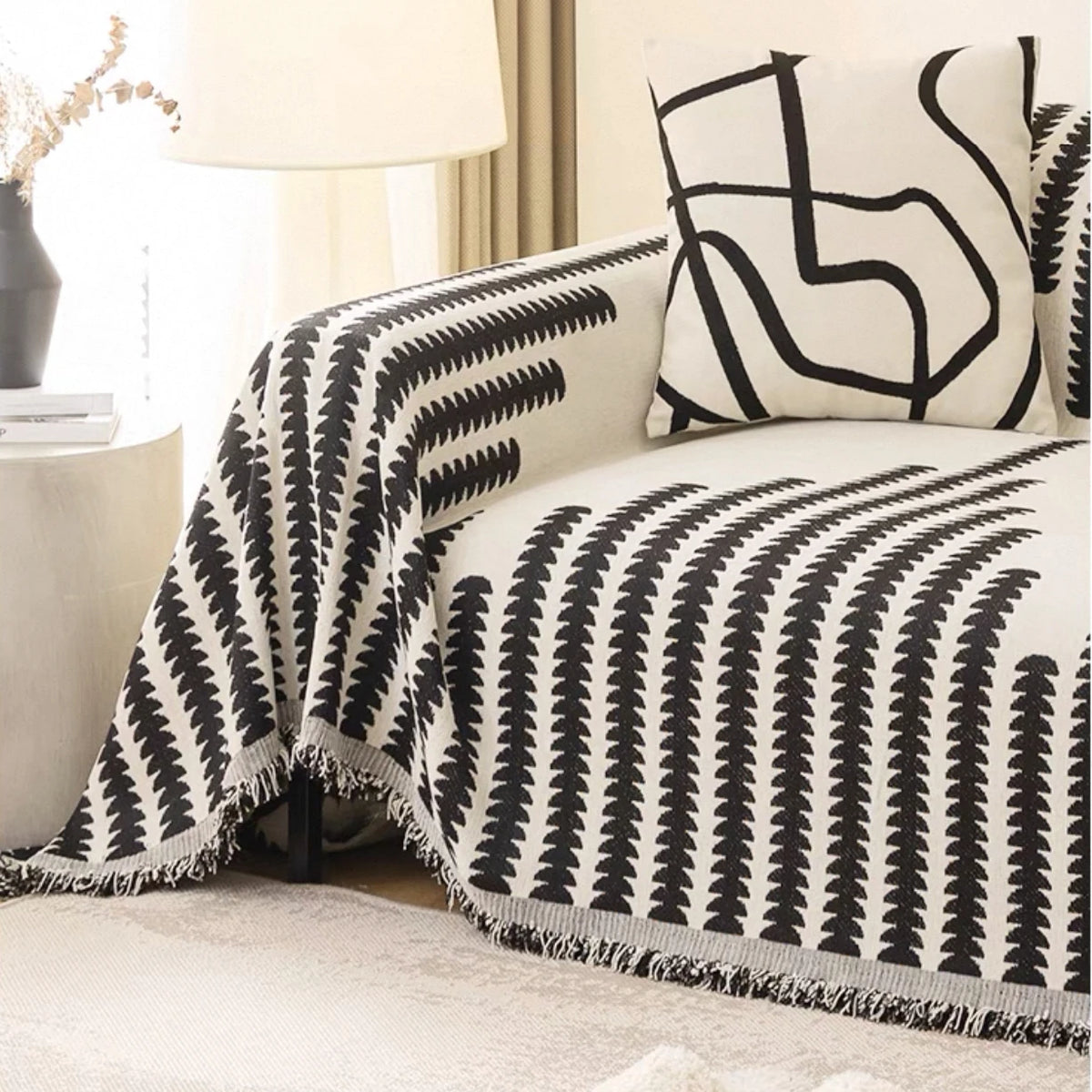 serviette canapé chenille jacquard motif feuilles noires blanc moderne opacité franges élégantes machine lavable