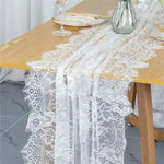nappe dentelle blanche noire motif floral bordure frangée transparente élégante table mangerété