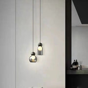 lampe suspendue moderne verre transparent laiton noir ampoule blanc chaud minimaliste contemporaine chambre salon