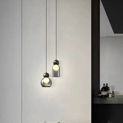 Lampe suspendue grise en verre transparent et laiton