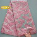 tissu dentelle polyester nylon largeur 51 pouces motifs feuilles stylisées couleurs noir vert rose