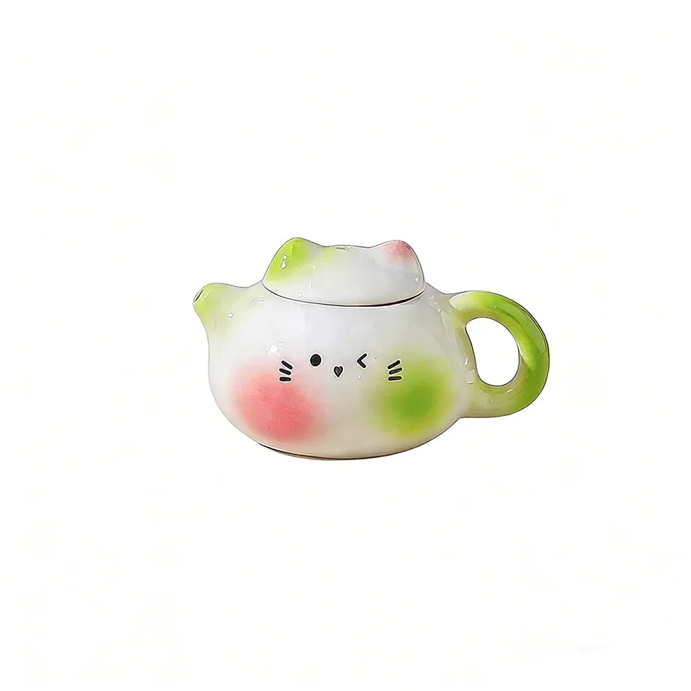 théière forme chat blanc orange rose visage mignon oreilles pointues taches oranges decorative cartoonish