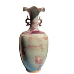 Vase en céramique vintage décoratif aux tons de vert, bleu et rose avec un motif craquelé unique.