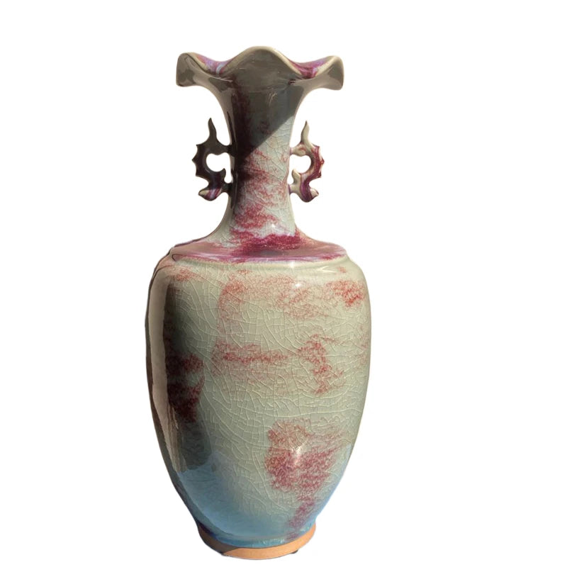 Vase en céramique vintage décoratif aux tons de vert, bleu et rose avec un motif craquelé unique.