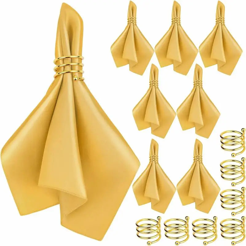 serviettes pliées serviettes satin noir or bleu roi classiques anneaux dorés table