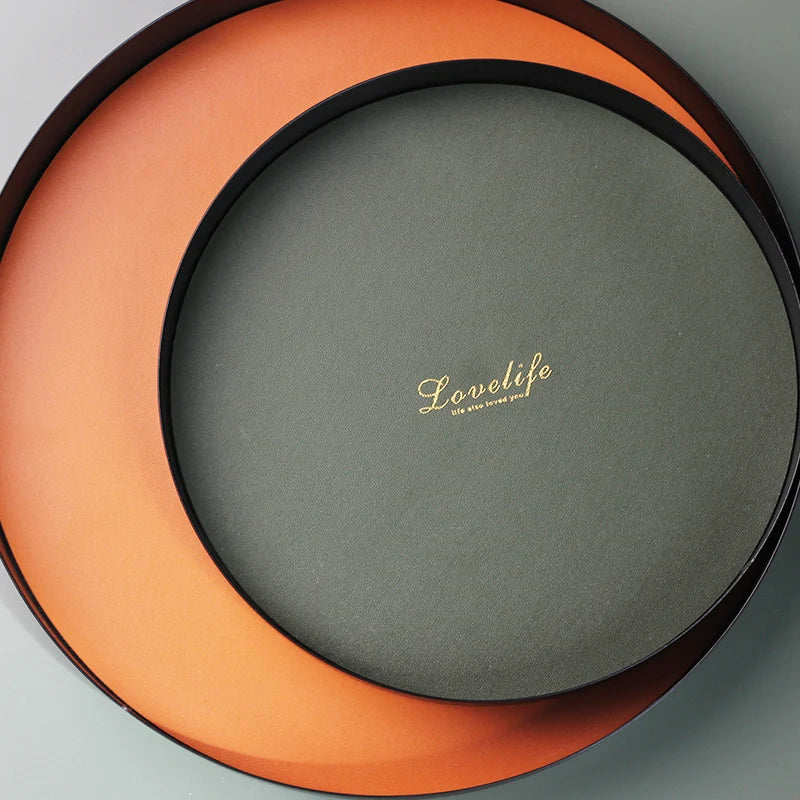 présentoir rond moderne plateau uni vert foncé orange noir maquillage soins parfums cosmétiques table