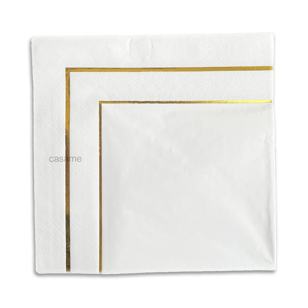vaisselle jetable dorée moderne serviettes blanches motifs points fourchettes couteaux cuillères gobelets festives or