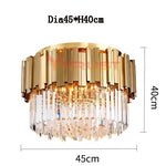 lampe moderne or cristal transparent élégante barres dorées inoxydables salon hall