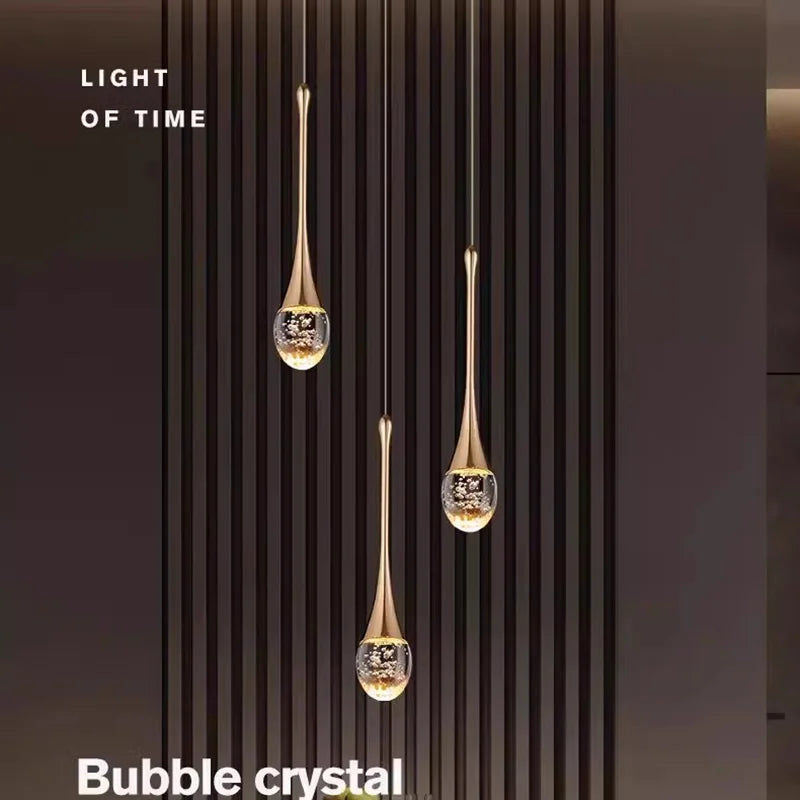 lampe suspendue moderne or noir cristal bulle brillant transparent chambre salon étude