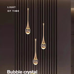 lampe suspendue moderne or noir cristal bulle brillant transparent chambre salon étude