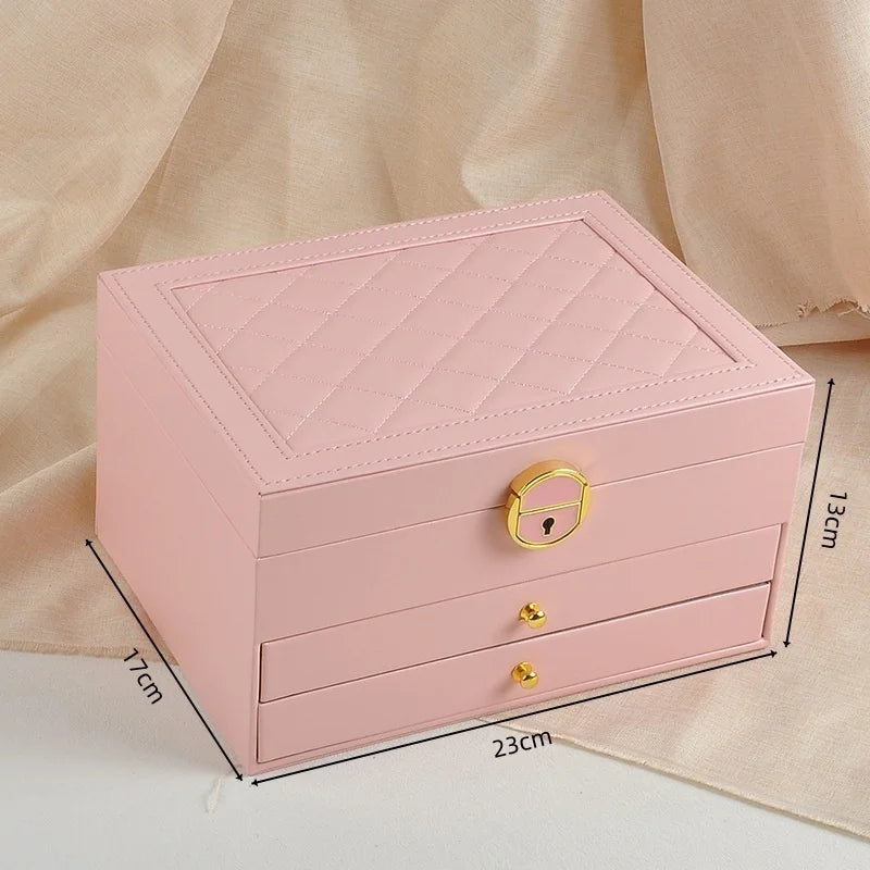 boîte bijoux cuir vert foncé blanc rose pâle motifs géométriques classique chic poignées dorées