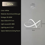 suspension lumineuse moderne pendentif noir blanc anneaux entrelacés fer silicège opaques 50 60cm led
