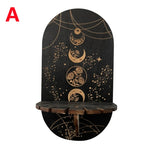 étagère murale noire dorée ornementations astrologiques pendeloques semi précieuses artisanal