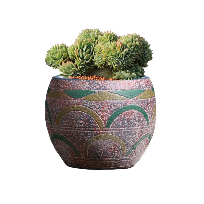 cache pot céramique artisanal méditerranéen couleurs vives motifs texturés plante verte intérieur moderne