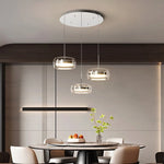suspension lumineuse moderne trois abat jours argentés abat jours transparents éclairage led salon chambre