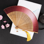 éventail pliant traditionnel vert foncé noir marron clair décoration mariage accessoire fête parfumé chinois