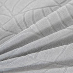 coussins canapé coton jacquard feuilles stylisées moderne gris clair marron foncé beige clair printemps