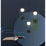 suspension végétale moderne plante artificielle lumière sphère lumineuse noir blanc vert minimaliste
