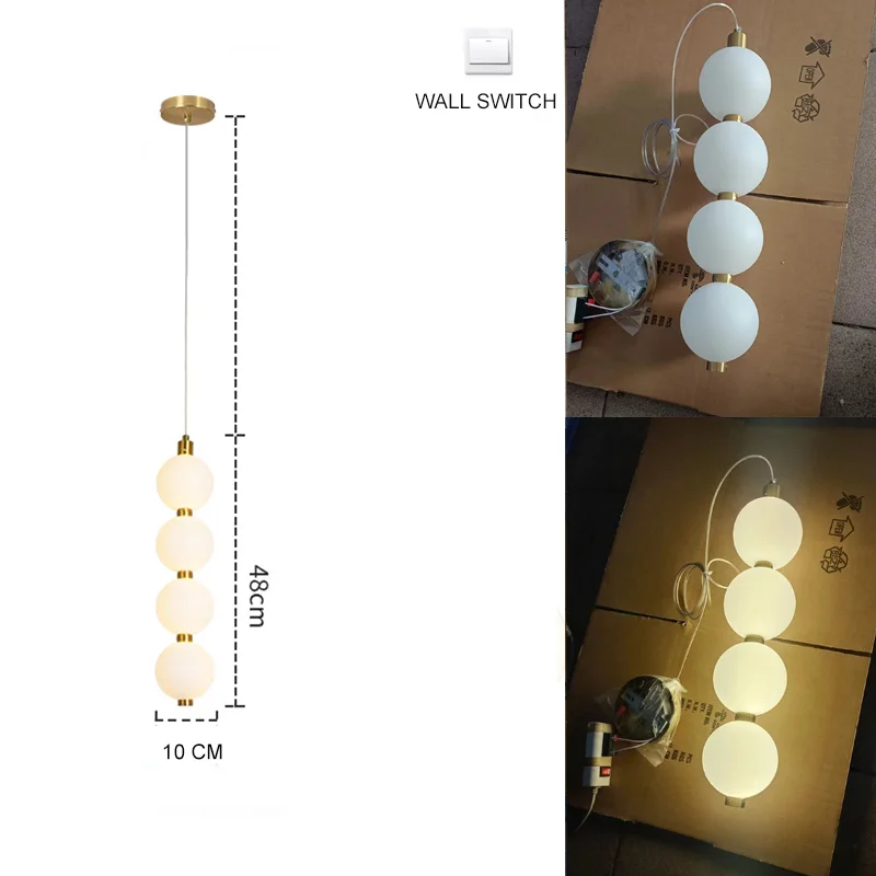 suspension lumineuse moderne blanc doré sphères translucides tiges métalliques chambre salon