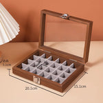 boîte bijoux contemporaine transparente compartiments blancs texture bois poignée métallique minimaliste organisation trousse toilette