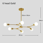 suspension lumineuse moderne or noir sphères translucides scandinave structure métallique pince suspension