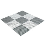 tapis salle bain modulable perforations texturées moderne jaune vert gris fixations noires éléments