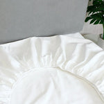 draps lit blancs satinés king size boutonnés complet moderne ecofriendly