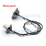 suspension lumineuse moderne élégante chaînes métalliques câble noir vis écrous bronze vert