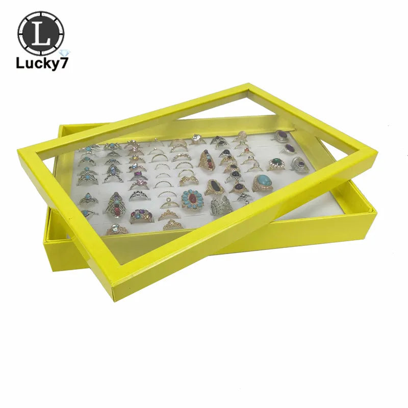 boîte bijoux moderne noir bleu jaune transparente 100 positions exposant anneaux sponge velvet packaging
