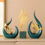 sculptures décoratives modernes feuilles stylisées couleurs or vert blanc artistiques salon
