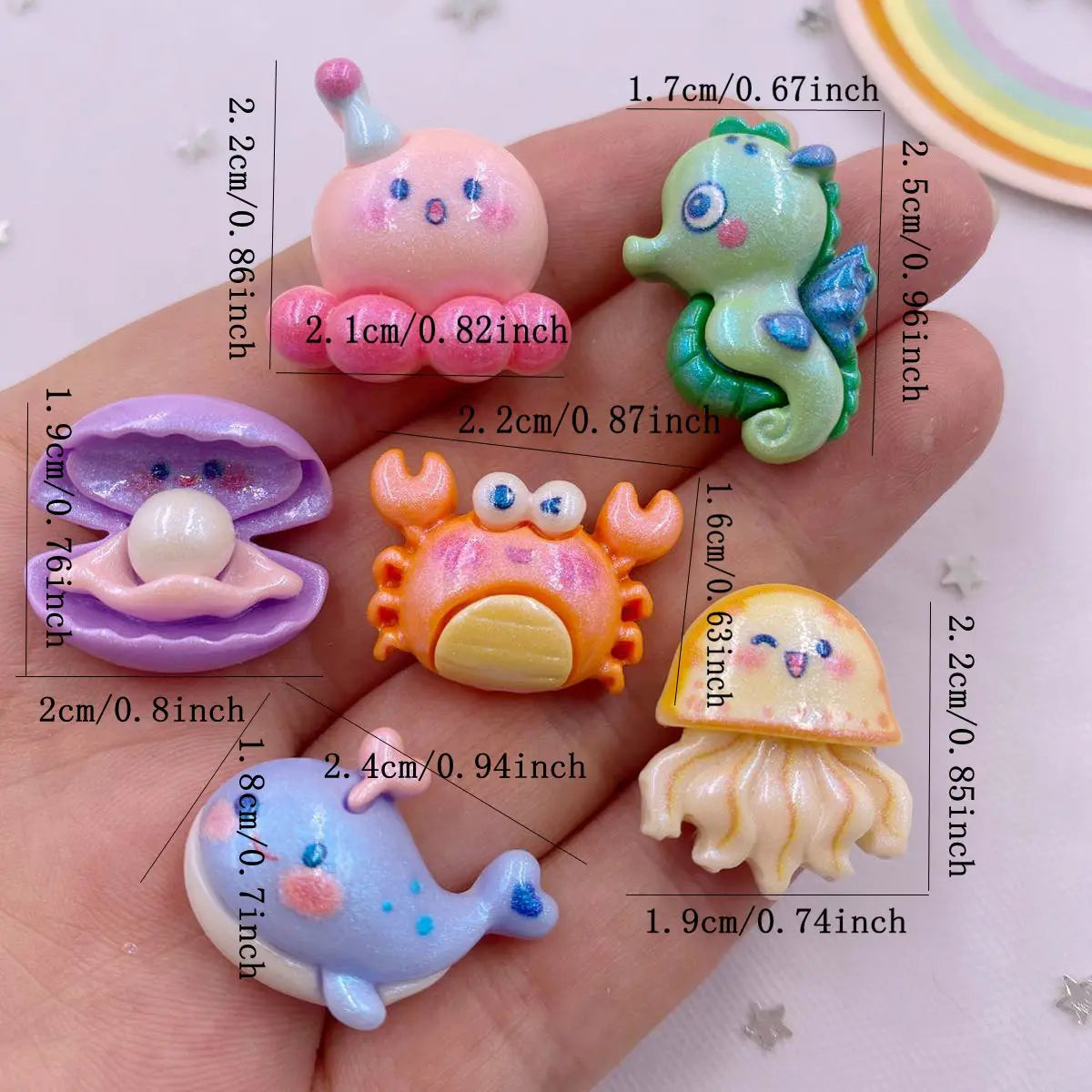 bijoux résine marine créatures poissons crabes pieuvres blanches rose verte